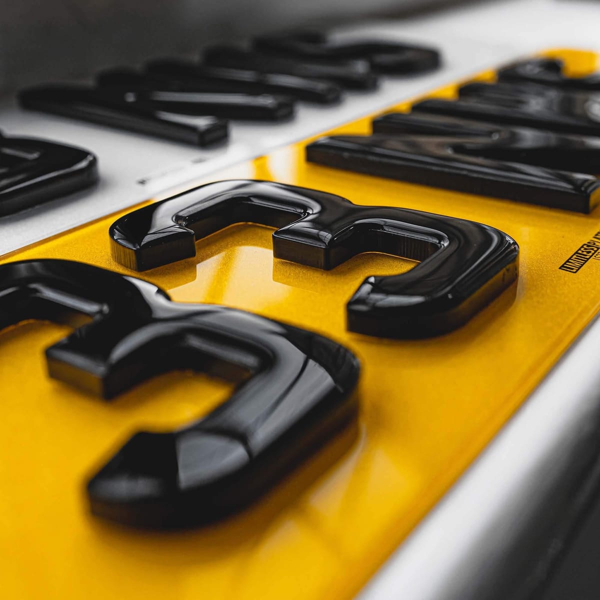 Rear 3D gel number plate with raised glossy characters on yellow