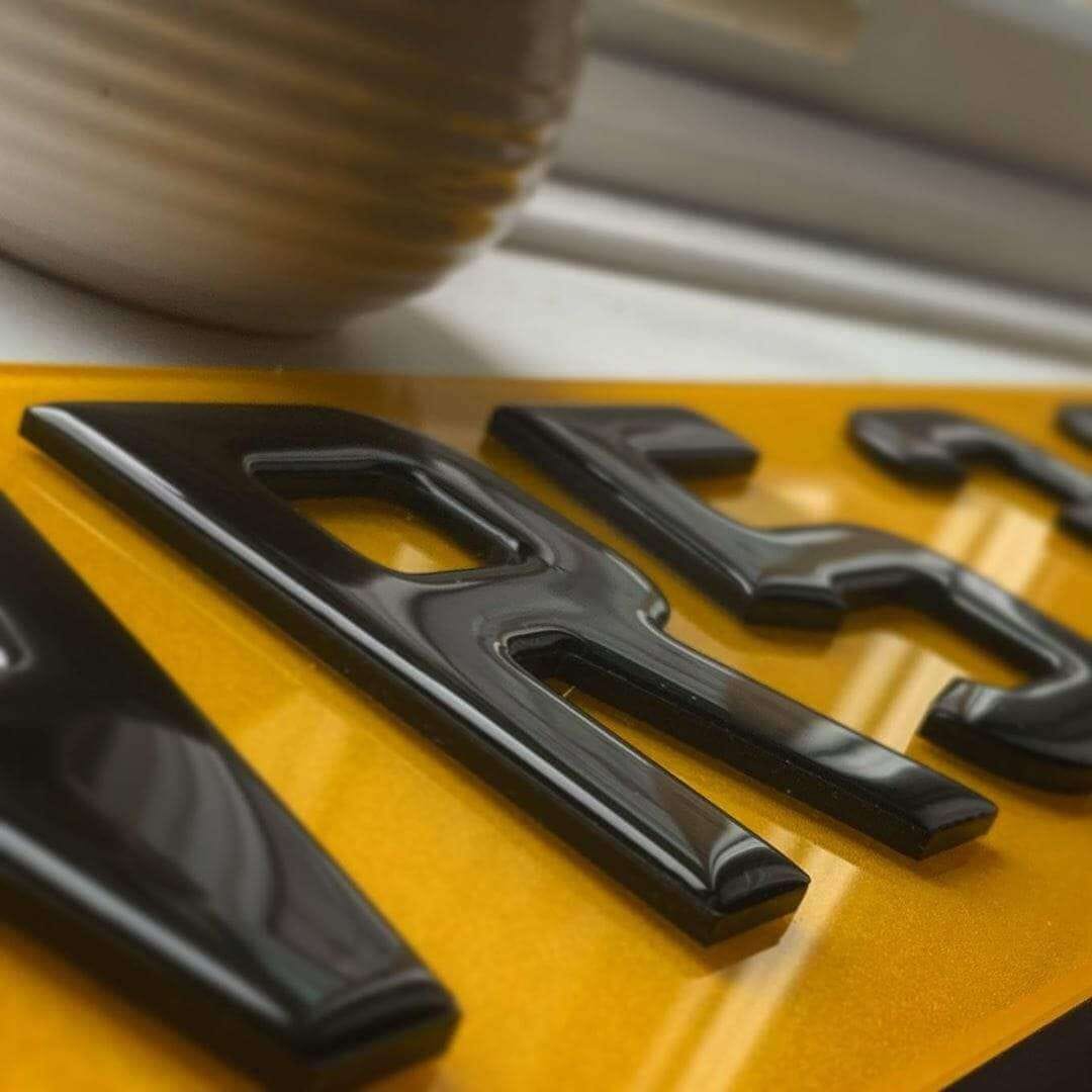3D gel number plate catching the light on the raised resin